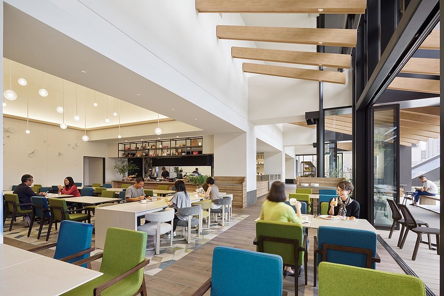 A group of people sitting at tables.